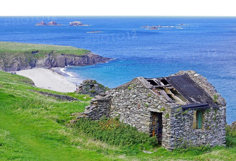 Stone ruins with grass cover on the coast with islands in the background, Blasket Islands, Dunmore Head, Ireland, Europe