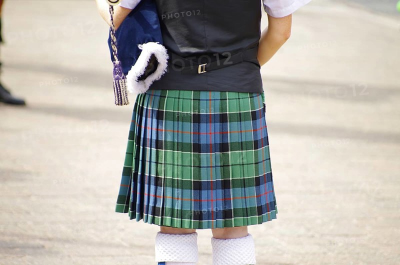 A person in a traditional Scottish kilt from behind, tradition, history, Scotland, Great Britain