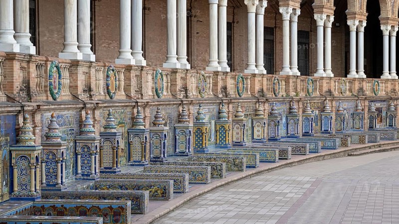 Colourful azulejos, colonnade and tiled benches of the pavilion at the Plaza de Espana in Seville, Andalusia, Spain, Europe