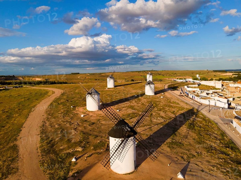 Several windmills in an open field on a sunny day with a few clouds in the sky, aerial view, windmills, Campo de Criptana, Ciudad Real province, Castilla-La Mancha, Route of Don Quixote, Spain, Europe