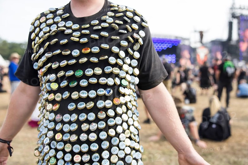 A festival visitor has decorated his shirt with bottle caps at the Wacken Open Air in Wacken. The traditional metal festival takes place from 31 July to 2 August 2024