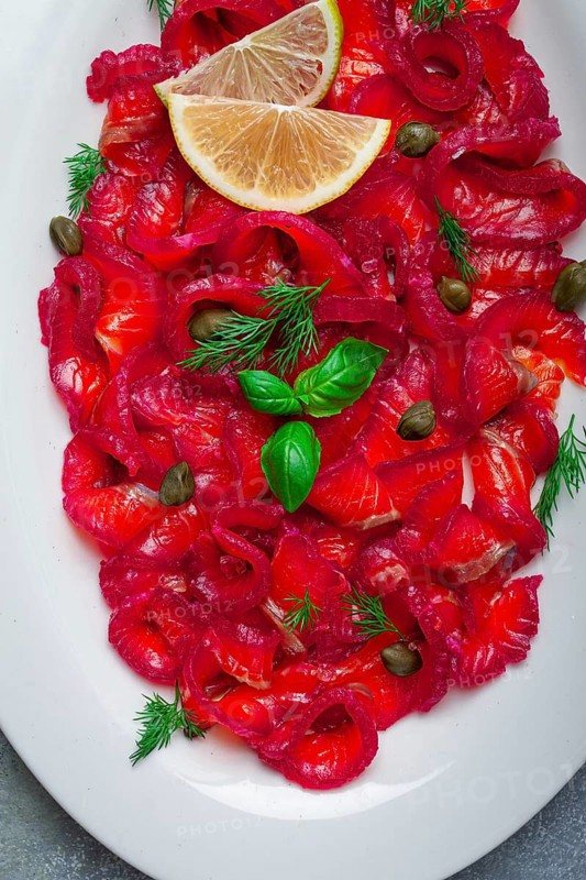 Salmon gravlax with beetroot, Scandinavian snack, beet gravlax, lightly salted fish, homemade, no people