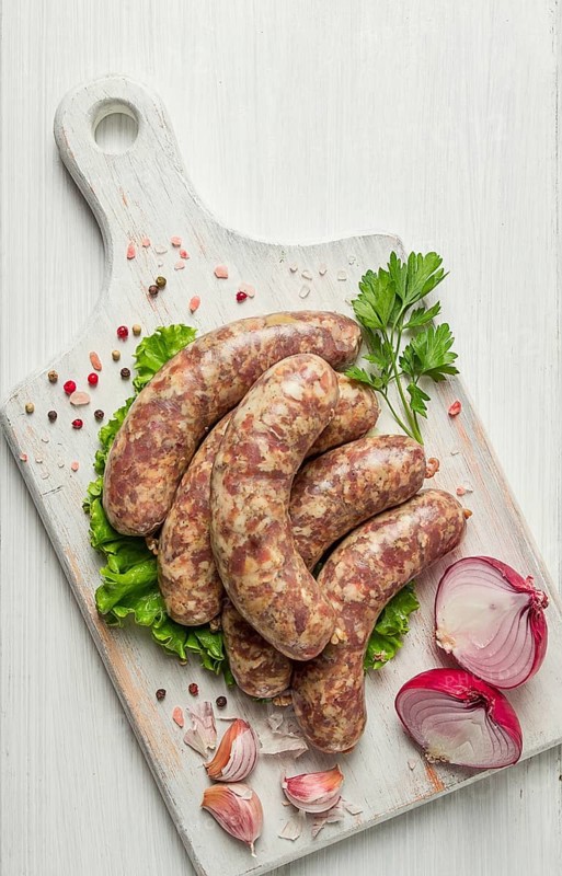 Raw kupaty, traditional Georgian sausages, raw sausages, with spices and herbs, Georgian cuisine