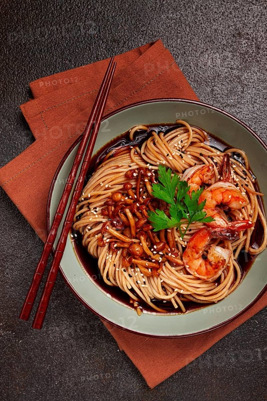 Soba, buckwheat noodles, with shimeji mushrooms and tiger shrimps, sesame, lime, parsley, homemade, no people