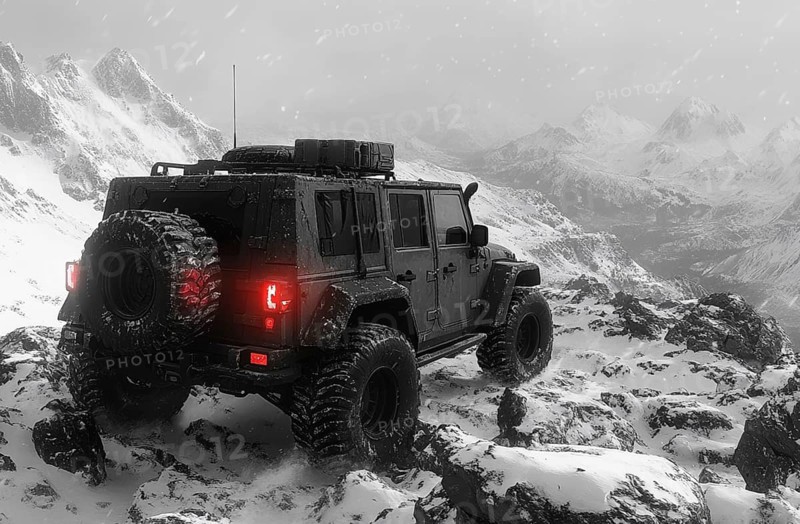 A black SUV navigating snowy rocky terrain with mountains in the background, during a snowstorm, AI generated