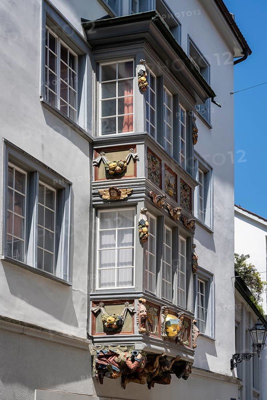 Artfully decorated bay window, stonemasonry work on a historic town house in the monastery quarter, historic old town of Sankt Gallen, Canton of St. Gallen, Switzerland, Europe