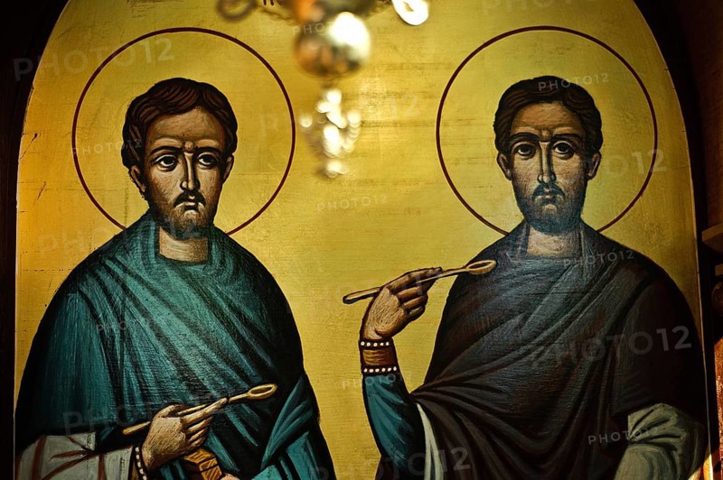 Painting representing Cosmas and Damian at the Sts Anargyroi church in Nairobi Kenya . Cosmas and Damian were two christian martyrs (3rd century AD) . They were known for practising medicine and surgery for free