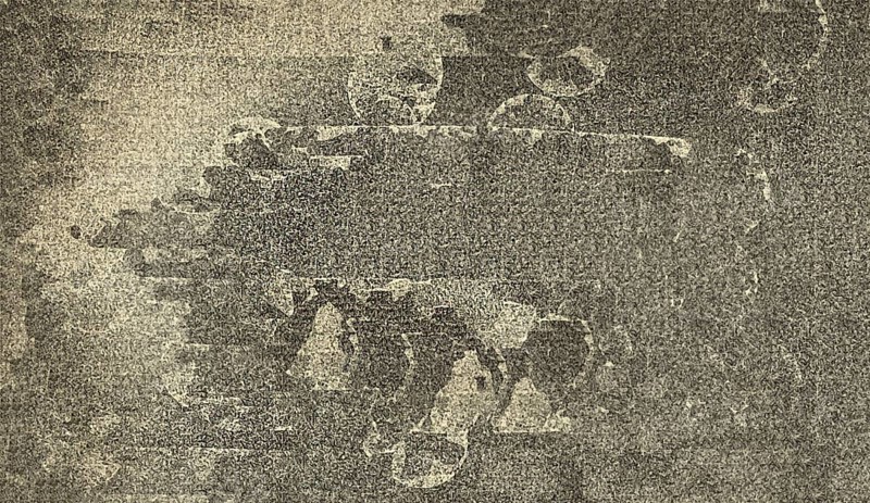 Abstract monochrome art with rough texture and circular patterns creating a distressed feel