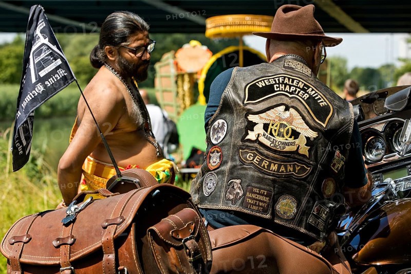 Elderly Harley Davidson rider and a Hindu at the temple festival, Encounter of Cultures, Datteln-Hamm Canal, Hamm, Ruhr Area, Germany, Europe