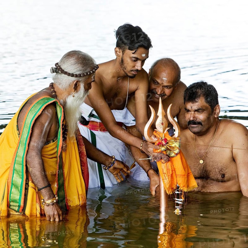 Head priest Siva Sri Arumugam Paskarakurukkal in the Datteln-Hamm canal during ritual purification, Hamm, Ruhr area, Germany, Europe