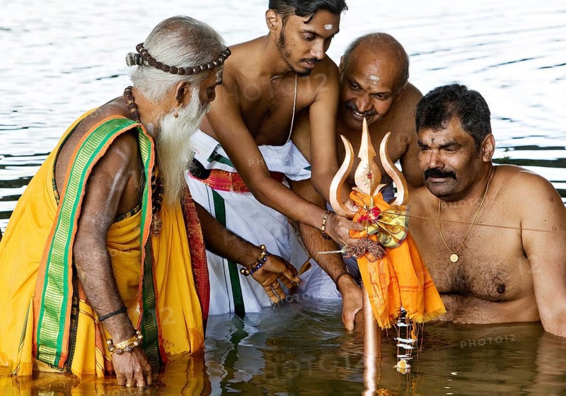 Head priest Siva Sri Arumugam Paskarakurukkal in the Datteln-Hamm canal during ritual purification, Hamm, Ruhr area, Germany, Europe
