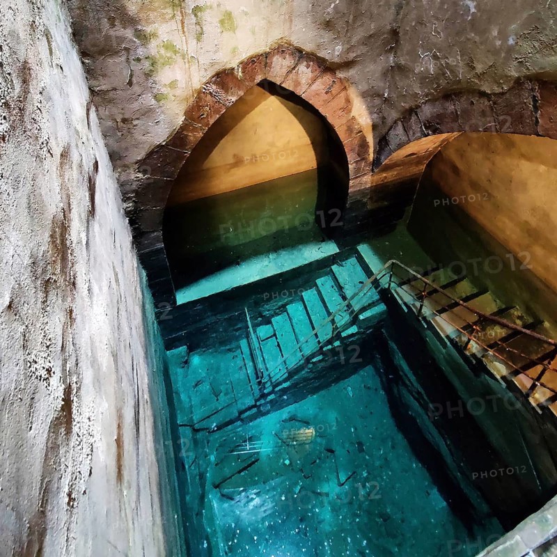 According to the inscription, the historic mikvah was built in 1260, the shaft is 25 metres deep and reaches the groundwater, Friedberg, Hesse, Germany, Europe