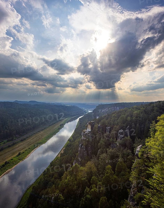 The Bastei is a rock formation with a viewing platform in Saxon Switzerland on the right bank of the River Elbe in the municipality of Lohmen between the spa town of Rathen and the town of Wehlen. It is one of the most visited tourist attractions in Saxon Switzerland. Dramatic sky over the Bastei, Saxon Switzerland, Rathen, Saxony, Germany, Europe