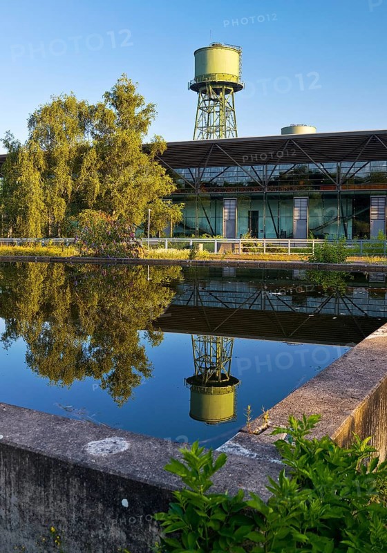 The water tower with the Jahrhunderthalle in Westpark, industrial heritage, Bochum, Ruhr area, North Rhine-Westphalia, Germany, Europe