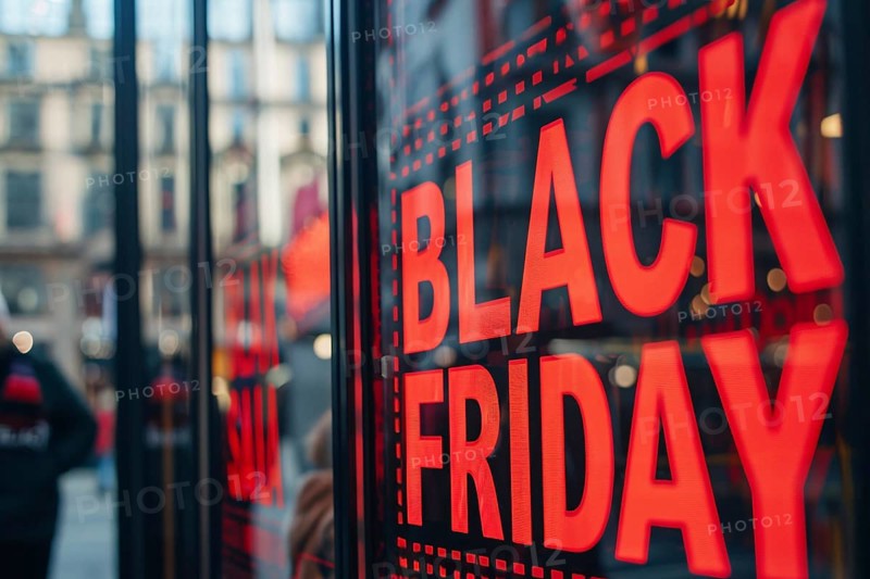 Black advertisement sign with red text 'Black Friday' in shopping window. Generative AI, AI generated