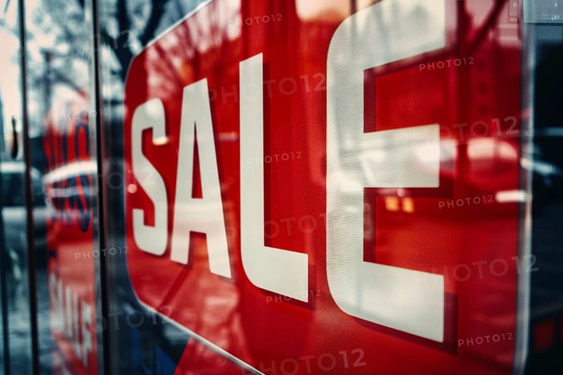 Red sale sign with text 'Sale' in shopping window. Generative AI, AI generated