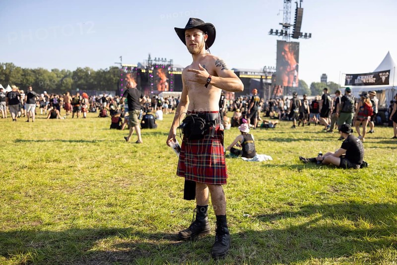 Festivalgoers in kilts at the Wacken Open Air in Wacken. The traditional metal festival takes place from 31 July to 2 August 2024