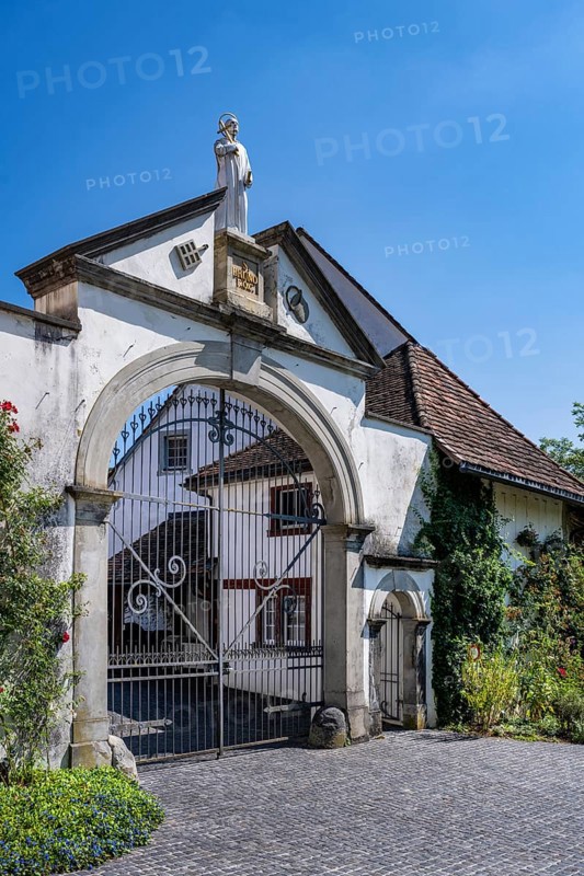 Lower entrance to Ittingen Charterhouse, a former Carthusian monastery with a statue of Bruno of Cologne, founder of the Carthusian Order, Ittingen Charterhouse, Warth-Weiningen near Frauenfeld, Canton Thurgau, Switzerland, Europe