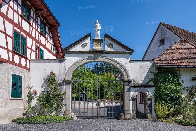 Lower entrance to Ittingen Charterhouse, a former Carthusian monastery with a statue of Bruno of Cologne, founder of the Carthusian Order, Ittingen Charterhouse, Warth-Weiningen near Frauenfeld, Canton Thurgau, Switzerland, Europe