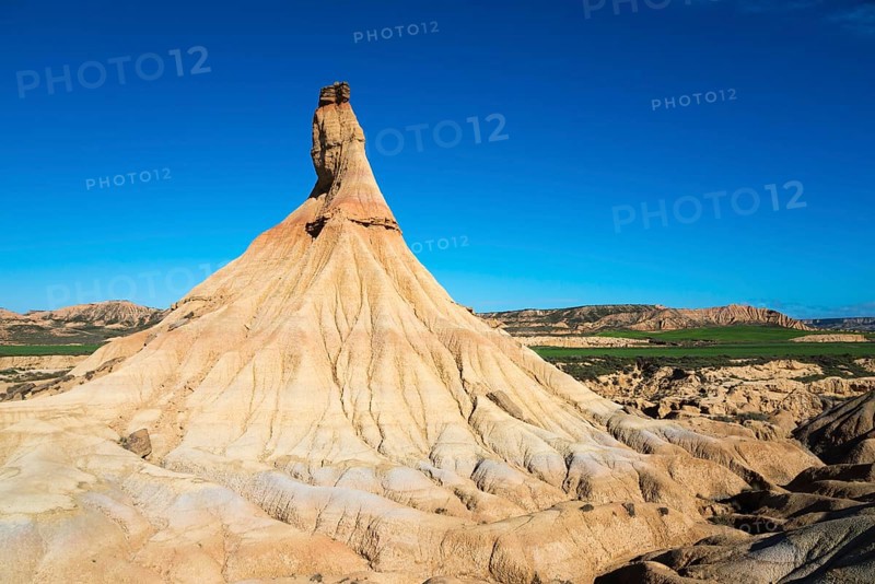 Striking rock formations rise up in an arid landscape under a deep blue sky, Castildetierra, Bardenas Reales Natural Park, desert, semi-desert, Navarre, Nafarroa, UNESCO Biosphere Reserve, Spain, Europe