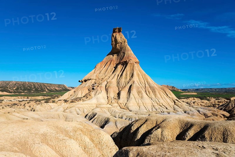 An impressive rock formation rises up in the desert-like landscape under a clear blue sky, Castildetierra, Bardenas Reales Natural Park, desert, semi-desert, Navarre, Nafarroa, UNESCO Biosphere Reserve, Spain, Europe