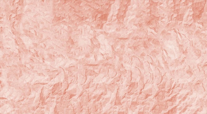 The image features a crumpled pink paper texture with a rough and wrinkled surface