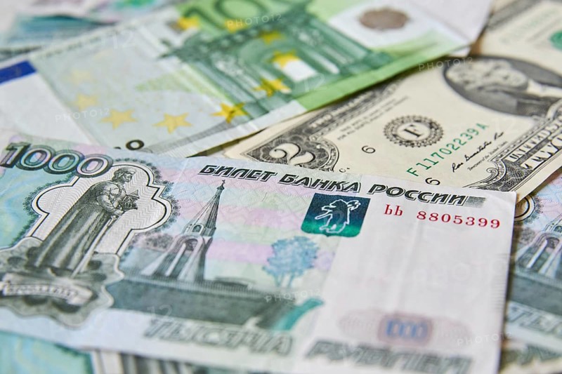 Background of paper bills dollars, euros and rubles. Currency exchange rate