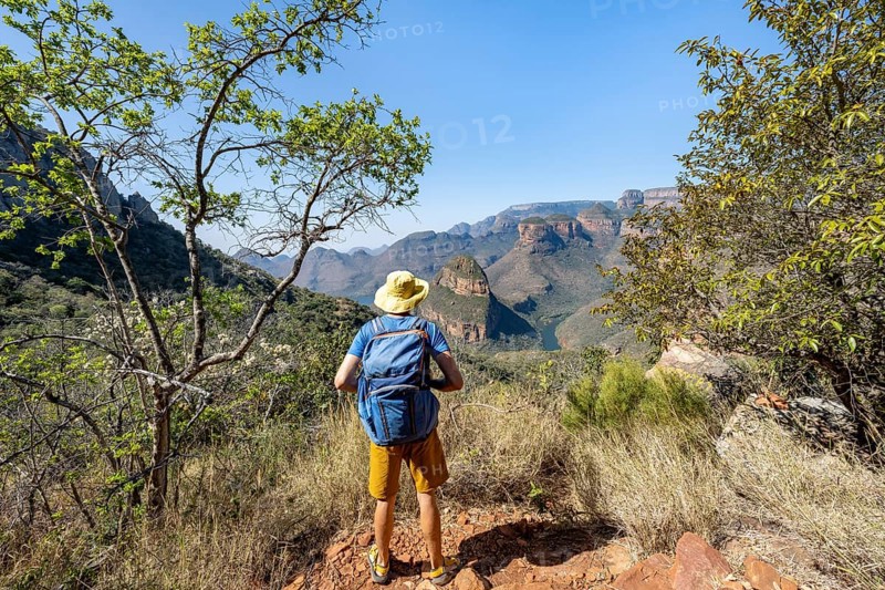 Hiker looking at canyon landscape, River loop at Blyde River Canyon with Three Rondawels peak, View of canyon with Blyde River and Table Mountains, Canyon landscape, Panorama Route, Mpumalanga, South Africa, Africa