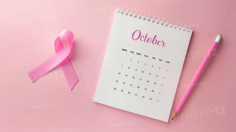Top view of October calendar and a breast cancer awareness pink ribbon over a pastel pink background, AI generated