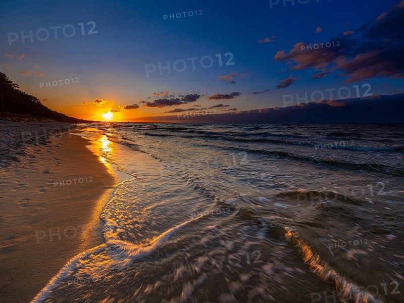 Sunset on a sandy beach on the island of Usedom on the Baltic Sea, Zempin, Mecklenburg-Western Pomerania, Germany, Europe