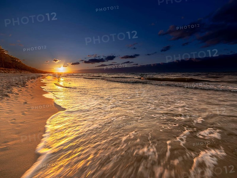 Sunset on a sandy beach on the island of Usedom on the Baltic Sea, Zempin, Mecklenburg-Western Pomerania, Germany, Europe