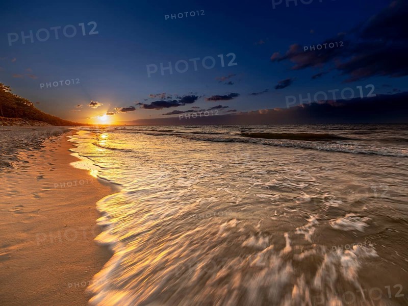 Sunset on a sandy beach on the island of Usedom on the Baltic Sea, Zempin, Mecklenburg-Western Pomerania, Germany, Europe