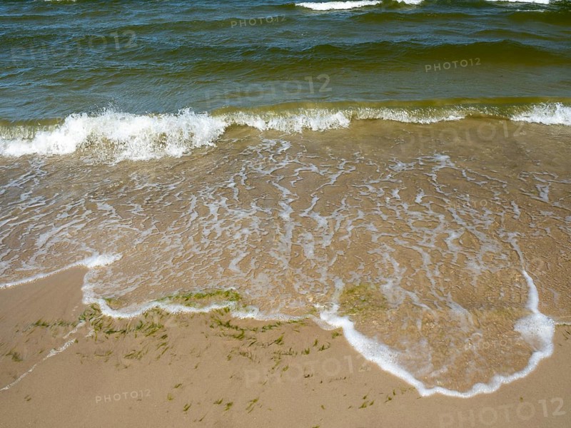 Water flowing onto the sandy beach on the island of Usedom on the Baltic Sea, Zempin, Mecklenburg-Vorpommern, Germany, Europe