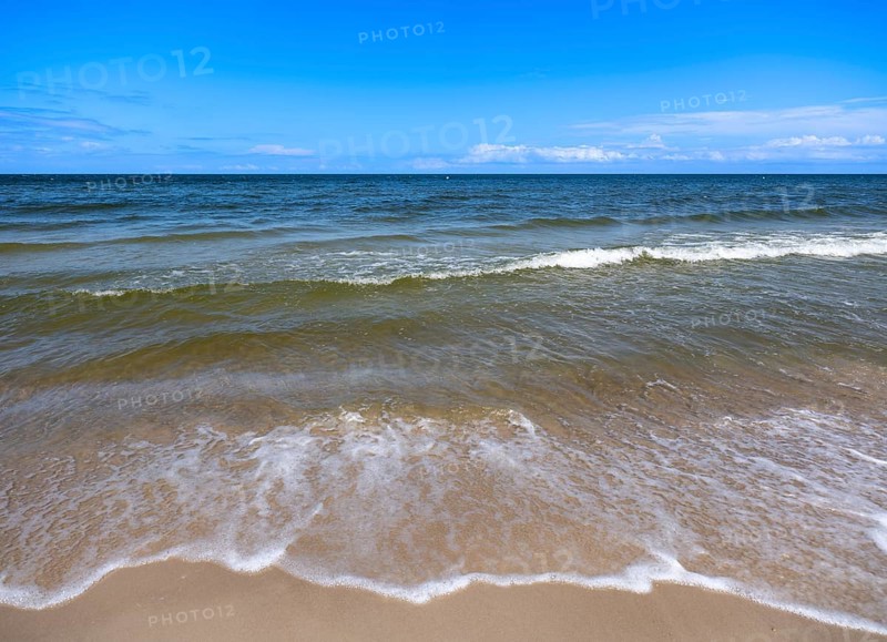 Water flowing onto the sandy beach on the island of Usedom on the Baltic Sea under a blue sky with clouds, Zempin, Mecklenburg-Vorpommern, Germany, Europe