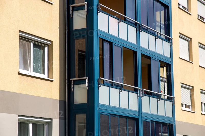 Living space extension through balcony glazing with sliding system