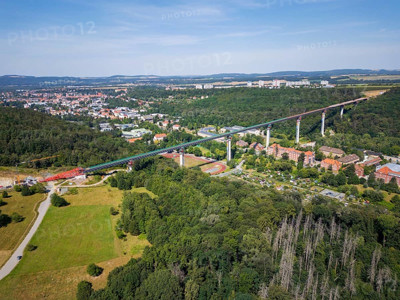 The new bridge on the Pirna southern bypass will be 916 metres long, 70 metres high and require 7, 250 tonnes of steel. DEGES is building the 3.8 kilometre long route. The route leads from the 172a to the B 172 on the Sonnenstein near Krietzschwitz and is intended to relieve Pirna city centre of through traffic in the future. For this purpose, a 50 metre long and 140 tonne heavy pre-build spigot will be pushed from the abutment on the Sonnenstein over the pillars that are already in place. The final push has been successfully completed and now the finishing work is underway, Gottleuba Valley Bridge, Pirna, Saxony, Germany, Europe