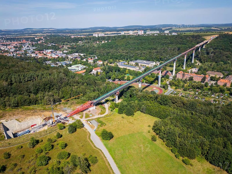 The new bridge on the Pirna southern bypass will be 916 metres long, 70 metres high and require 7, 250 tonnes of steel. DEGES is building the 3.8 kilometre long route. The route leads from the 172a to the B 172 on the Sonnenstein near Krietzschwitz and is intended to relieve Pirna city centre of through traffic in the future. For this purpose, a 50 metre long and 140 tonne heavy pre-build spigot will be pushed from the abutment on the Sonnenstein over the pillars that are already in place. The final push has been successfully completed and now the finishing work is underway, Gottleuba Valley Bridge, Pirna, Saxony, Germany, Europe
