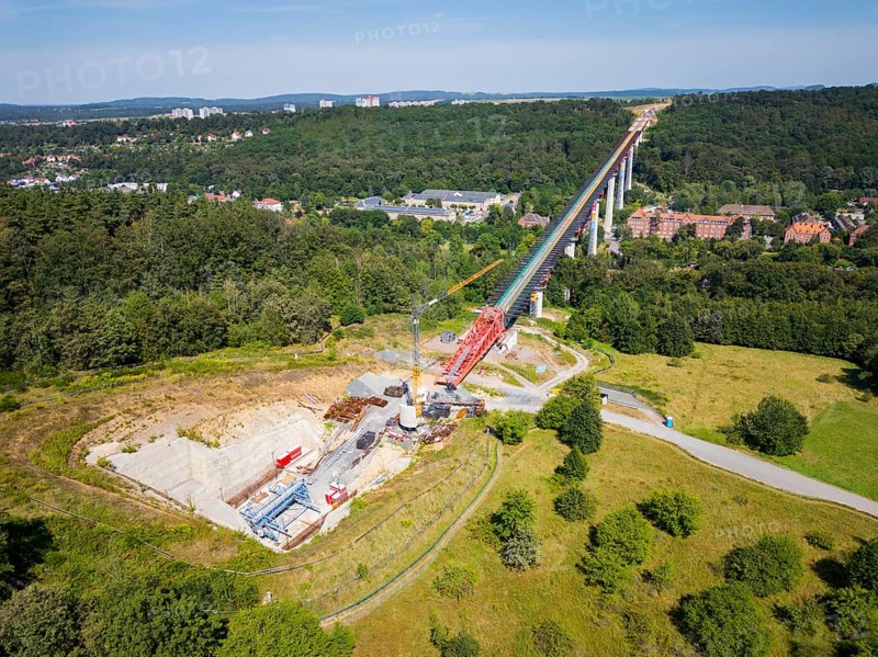 The new bridge on the Pirna southern bypass will be 916 metres long, 70 metres high and require 7, 250 tonnes of steel. DEGES is building the 3.8 kilometre long route. The route leads from the 172a to the B 172 on the Sonnenstein near Krietzschwitz and is intended to relieve Pirna city centre of through traffic in the future. For this purpose, a 50 metre long and 140 tonne heavy pre-build spigot will be pushed from the abutment on the Sonnenstein over the pillars that are already in place. The final push has been successfully completed and now the finishing work is underway, Gottleuba Valley Bridge, Pirna, Saxony, Germany, Europe