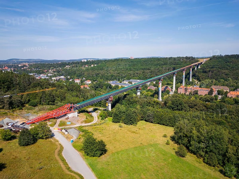The new bridge on the Pirna southern bypass will be 916 metres long, 70 metres high and require 7, 250 tonnes of steel. DEGES is building the 3.8 kilometre long route. The route leads from the 172a to the B 172 on the Sonnenstein near Krietzschwitz and is intended to relieve Pirna city centre of through traffic in the future. For this purpose, a 50 metre long and 140 tonne heavy pre-build spigot will be pushed from the abutment on the Sonnenstein over the pillars that are already in place. The final push has been successfully completed and now the finishing work is underway, Gottleuba Valley Bridge, Pirna, Saxony, Germany, Europe