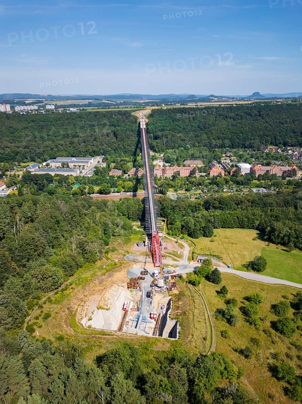 The new bridge on the Pirna southern bypass will be 916 metres long, 70 metres high and require 7, 250 tonnes of steel. DEGES is building the 3.8 kilometre long route. The route leads from the 172a to the B 172 on the Sonnenstein near Krietzschwitz and is intended to relieve Pirna city centre of through traffic in the future. For this purpose, a 50 metre long and 140 tonne heavy pre-build spigot will be pushed from the abutment on the Sonnenstein over the pillars that are already in place. The final push has been successfully completed and now the finishing work is underway, Gottleuba Valley Bridge, Pirna, Saxony, Germany, Europe