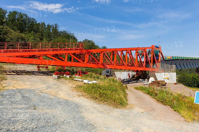 The new bridge on the Pirna southern bypass will be 916 metres long, 70 metres high and require 7, 250 tonnes of steel. DEGES is building the 3.8 kilometre long route. The route leads from the 172a to the B 172 on the Sonnenstein near Krietzschwitz and is intended to relieve Pirna city centre of through traffic in the future. For this purpose, a 50 metre long and 140 tonne heavy pre-build spigot will be pushed from the abutment on the Sonnenstein over the pillars that are already in place. The final push has been successfully completed and now the finishing work is underway, Gottleuba Valley Bridge, Pirna, Saxony, Germany, Europe