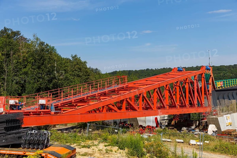 The new bridge on the Pirna southern bypass will be 916 metres long, 70 metres high and require 7, 250 tonnes of steel. DEGES is building the 3.8 kilometre long route. The route leads from the 172a to the B 172 on the Sonnenstein near Krietzschwitz and is intended to relieve Pirna city centre of through traffic in the future. For this purpose, a 50 metre long and 140 tonne heavy pre-build spigot will be pushed from the abutment on the Sonnenstein over the pillars that are already in place. The final push has been successfully completed and now the finishing work is underway, Gottleuba Valley Bridge, Pirna, Saxony, Germany, Europe