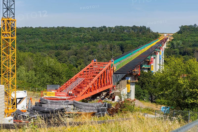 The new bridge on the Pirna southern bypass will be 916 metres long, 70 metres high and require 7, 250 tonnes of steel. DEGES is building the 3.8 kilometre long route. The route leads from the 172a to the B 172 on the Sonnenstein near Krietzschwitz and is intended to relieve Pirna city centre of through traffic in the future. For this purpose, a 50 metre long and 140 tonne heavy pre-build spigot will be pushed from the abutment on the Sonnenstein over the pillars that are already in place. The final push has been successfully completed and now the finishing work is underway, Gottleuba Valley Bridge, Pirna, Saxony, Germany, Europe