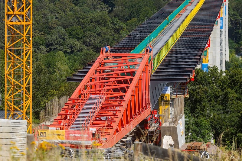 The new bridge on the Pirna southern bypass will be 916 metres long, 70 metres high and require 7, 250 tonnes of steel. DEGES is building the 3.8 kilometre long route. The route leads from the 172a to the B 172 on the Sonnenstein near Krietzschwitz and is intended to relieve Pirna city centre of through traffic in the future. For this purpose, a 50 metre long and 140 tonne heavy pre-build spigot will be pushed from the abutment on the Sonnenstein over the pillars that are already in place. The final push has been successfully completed and now the finishing work is underway, Gottleuba Valley Bridge, Pirna, Saxony, Germany, Europe