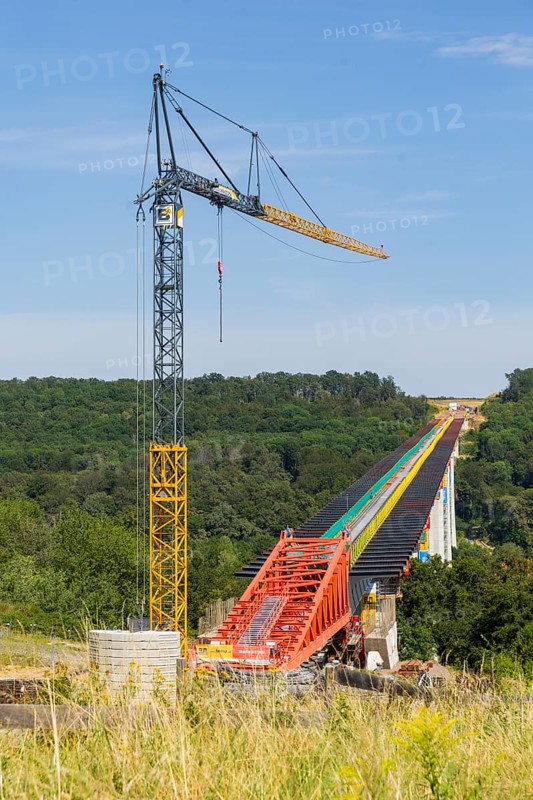 The new bridge on the Pirna southern bypass will be 916 metres long, 70 metres high and require 7, 250 tonnes of steel. DEGES is building the 3.8 kilometre long route. The route leads from the 172a to the B 172 on the Sonnenstein near Krietzschwitz and is intended to relieve Pirna city centre of through traffic in the future. For this purpose, a 50 metre long and 140 tonne heavy pre-build spigot will be pushed from the abutment on the Sonnenstein over the pillars that are already in place. The final push has been successfully completed and now the finishing work is underway, Gottleuba Valley Bridge, Pirna, Saxony, Germany, Europe