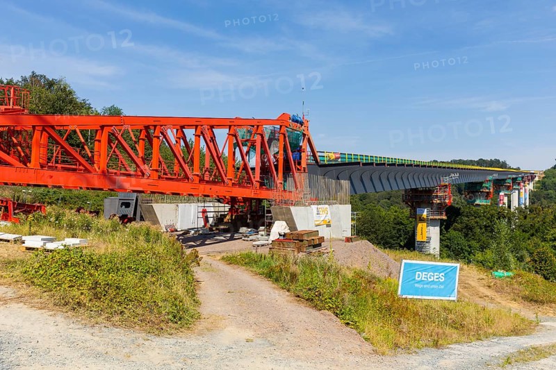 The new bridge on the Pirna southern bypass will be 916 metres long, 70 metres high and require 7, 250 tonnes of steel. DEGES is building the 3.8 kilometre long route. The route leads from the 172a to the B 172 on the Sonnenstein near Krietzschwitz and is intended to relieve Pirna city centre of through traffic in the future. For this purpose, a 50 metre long and 140 tonne heavy pre-build spigot will be pushed from the abutment on the Sonnenstein over the pillars that are already in place. The final push has been successfully completed and now the finishing work is underway, Gottleuba Valley Bridge, Pirna, Saxony, Germany, Europe