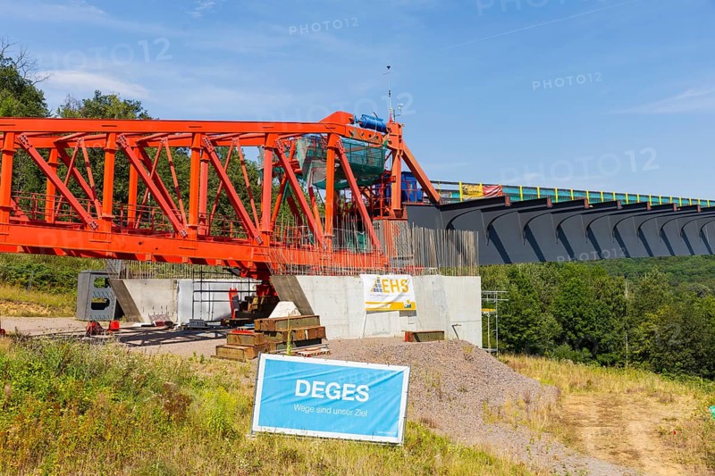 The new bridge on the Pirna southern bypass will be 916 metres long, 70 metres high and require 7, 250 tonnes of steel. DEGES is building the 3.8 kilometre long route. The route leads from the 172a to the B 172 on the Sonnenstein near Krietzschwitz and is intended to relieve Pirna city centre of through traffic in the future. For this purpose, a 50 metre long and 140 tonne heavy pre-build spigot will be pushed from the abutment on the Sonnenstein over the pillars that are already in place. The final push has been successfully completed and now the finishing work is underway, Gottleuba Valley Bridge, Pirna, Saxony, Germany, Europe