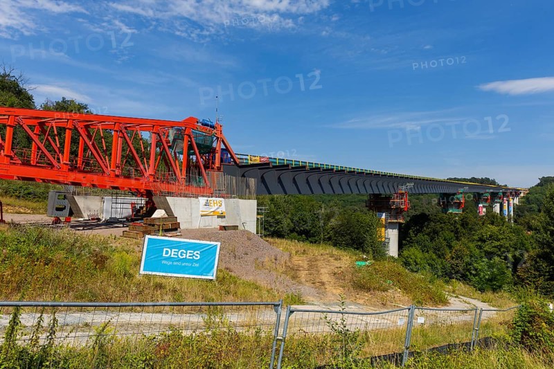 The new bridge on the Pirna southern bypass will be 916 metres long, 70 metres high and require 7, 250 tonnes of steel. DEGES is building the 3.8 kilometre long route. The route leads from the 172a to the B 172 on the Sonnenstein near Krietzschwitz and is intended to relieve Pirna city centre of through traffic in the future. For this purpose, a 50 metre long and 140 tonne heavy pre-build spigot will be pushed from the abutment on the Sonnenstein over the pillars that are already in place. The final push has been successfully completed and now the finishing work is underway, Gottleuba Valley Bridge, Pirna, Saxony, Germany, Europe