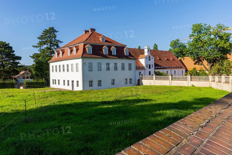 Berthelsdorf Castle is a heritage-protected building in Berthelsdorf, a district of the East Saxon town of Herrnhut in the district of Görlitz. The manor house was given its present form by Nikolaus Ludwig von Zinzendorf, which is why the castle is also known today as Zinzendorf Castle . Between 1721 and 1724, a uniform structure with a symmetrical seven-axis appearance on the courtyard side was built, largely utilising the existing substance, Zinzendorf Castle Berthelsdorf, Berthelsdorf, Saxony, Germany, Europe