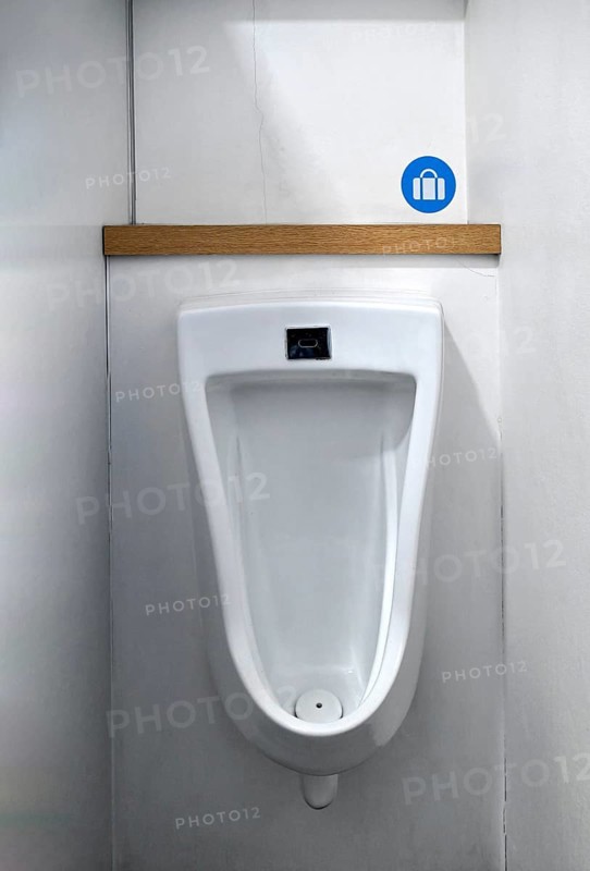 Urinal with bag holder